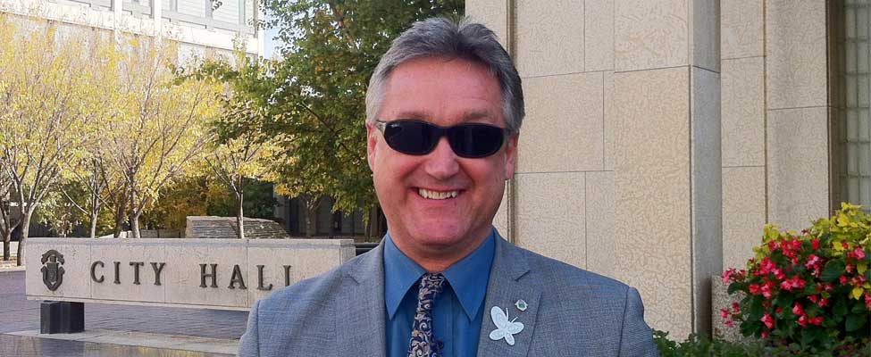 Ross Eadie in front of the Winnepeg City Hall Sign October 2013